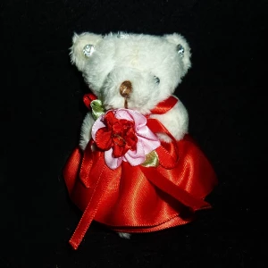 Фото Мягкая игрушка мишка в платье с бантом